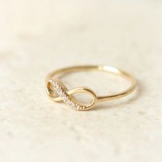 an image of a gold ring with diamonds on the bottom and in the middle that says best seller holiday sale