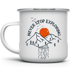 a white enamel mug with the words never stop exploring and an orange heart on it