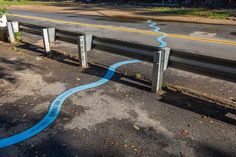 a road that has been painted with blue tape