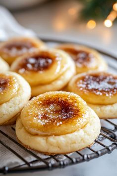 some sugary cookies are cooling on a wire rack