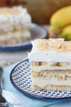 a piece of cake sitting on top of a blue and white plate next to bananas