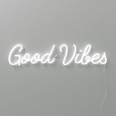 a neon sign that reads good vibes