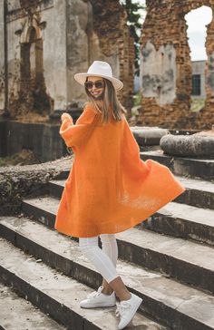 "DETAILS 62% kid mohair, 38% polyamide SIZE: Onesize Color: Orange Standard length: 35.4\" (90 cm)  Model is 5,7\" (175 cm) and wearing onesize  This amazing bright color long sweater coat is made of soft yarn and is more than comfortable. Those who like to look stylish and feel comfortable in breezy weather will appreciate this kind of long coat.  Please note that there might be some colors discrepancies due to the different monitor settings. HANDMADE. Every item is handmade and takes approximately 2 to 5 weeks to make, that is why every one is unique as yourself. CUSTOM ORDERS. I spend a lot of time creating each model. But every item and every person is unique, so I would be happy to provide you with a clothes your would feel comfortable in and would love to ware. We can do the followin Long Orange Outerwear For Fall, Long Orange Outerwear For Spring, Long Orange Spring Outerwear, Orange Open Front Cardigan For Spring, Orange Long Sleeve Summer Cardigan, Trendy Orange Winter Cardigan, Cozy Orange Outerwear For Spring, Oversized Orange Cardigan For Winter, Oversized Orange Winter Cardigan