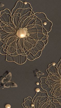 an intricately designed wallpaper with gold flowers and butterflies on the side, along with pearls