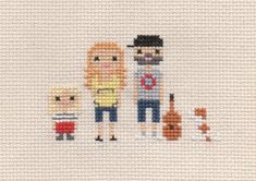 a cross stitch pattern with three people and two dogs