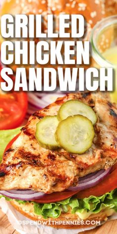 grilled chicken sandwich with lettuce, tomato and cucumber on the side