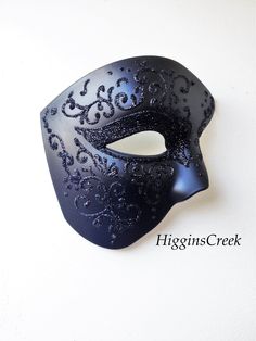 luxury Men's Phantom Mask in a variety high quality paints and shimmers. The mask pictured is the black/black shimmer option; black mask base with classic filigree pattern intricately drawn and highlighted with fine black Onyx Shimmer. You can pick custom design and color option if you would like a customized mask in a different pattern/color combination to match your attire/theme. I N C L U D E D All Masks come with matching double sided satin ribbons attached. S H I P P I N G - Processed same Royal Blue Masquerade Mask, Blue Masquerade Mask Men, Black Grooms, Blue Masquerade Masks, Wedding Masquerade, White Masquerade Mask, Phantom Mask, Elegant Face Mask