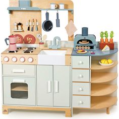 a toy kitchen with an oven, stove and sink