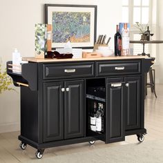 a black kitchen island with wine bottles on it