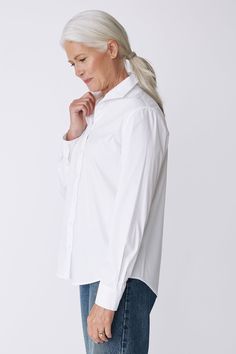 With a tailored look yet an ease of fit, our Box Pleat Ginna shirt is made for women on the move. A unique single piece collar construction can be worn up or softly folded befitting your mood. Back box pleat, center front exposed button closure, classic cuff length, sleeve placket detail, and signature loop detail. - 83% Cotton, 14% Polyamide, 3% Elastin - Made in NYC - Dry clean or machine wash - Our model is 5'9.5" wearing size 4 - Chest Width 40", Hip Width 45", Length 28" Orders are processed within three business days (not including weekends or holidays). All pre-orders are charged at the time of purchase and shipped on the date indicated on each style. All returns are subject to a per order restocking fee. Please visit the RETURNS/EXCHANGES page to review our policies regarding retur Fitted Collared Timeless Top, Fitted Timeless Collared Top, Timeless Fitted Collared Top, Timeless Blouse With Fold Down Collar For Daywear, Timeless Collared Tops For Business Casual, Modern Spread Collar Blouse For Business Casual, Modern Business Casual Blouse With Spread Collar, Modern White Blouse With Fold Down Collar, Classic Blouse With Lapel Collar