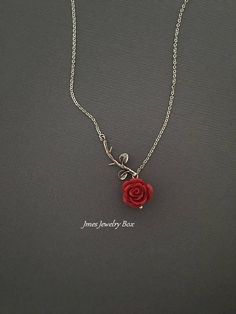 Sweet red rose and silver branch necklace. Very dainty but sturdy. Silver branch and red rose are on an 18'' stainless steel chain with lobster clasp. *Stainless steel chain *Silver brass branch *15mm resin rose *Handmade with love <3 Also available as a bracelet https://www.etsy.com/listing/665169824/silver-branch-and-red-rose-bracelet-rose?ref=shop_home_active_1 Like Jmesjewelrybox on Facebook for updates on new jewelry, upcoming sales and giveaways! Plus Facebook fans save 5% :D Find the c Red And Silver Necklace, Red Rose Necklace, Beauty And The Beast Necklace, Red Rose Jewelry, Rose Branch, Rose Accessories, Rose Jewellery, Rose Pendant Necklace, Resin Rose