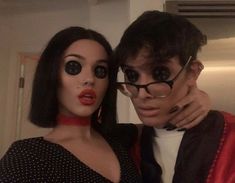 a man and woman with fake eyeballs on their faces