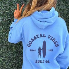 "Coastline, Surfboard Hoodie | Beach Bum sweatshirt, Beach Day, Surf shop Sorority Shirts: https://etsy.me/34dVqt9 Sorority Sweatshirts: https://etsy.me/360xXMs Sorority Accessories: https://etsy.me/30SCQVv 🌻 Please read the full description: This hoodie/sweatshirt sizing is NOT oversized. You need to order at least 1-2 sizes larger for the extra baggy look in this photo. (The normal sizing is UNISEX.) 🔔 Example: if you use size S choose between a size L or XL. 💡 HOW TO PLACE YOUR ORDER: 1. P Sorority Accessories, Preppy Hoodie, Clothes Preppy, Ocean Surfing, Surf Hoodie, Save The Ocean, Sorority Sweatshirts, Beach Sweatshirt, Ocean Surf