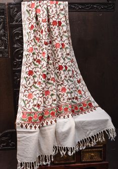 Kashmir's picturesque and stunning landscape has long inspired the artisans of the region. Boasting an Ivory tone with multicolor floral aari embroidery, this Kashmiri Aari work shawl crafted from poly woo features beautiful flower embroidery with a shaded look. Pair this with your sarees, skirts, dresses and even with men's wear to elevate your elegance quotient by a few notches! *Note: Color and shading may slightly vary due to lighting conditions. Aari Embroidery, Aari Work, Men's Wear, Flower Embroidery, Beautiful Flower, Embroidery Flowers, Beautiful Flowers, Shawl