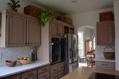 a kitchen with wooden cabinets and stainless steel appliances