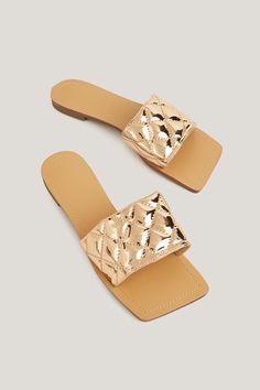 Revitalize your summer wardrobe with our Quilted Metallic Square Toe Sandals. The eye-catching metallic finish and quilted detailing make these sandals a stylish essential for the season. Product code: CAB01B4A001GG Features:  Lining: 100%RUBBER Material: 100%POLYURETHANE. Chic Metallic Sandals For Summer, Metallic Sandals For Summer Beach, Metallic Sandals For Beach In Summer, Trendy Gold Sandals With Textured Footbed, Chic Metallic Synthetic Sandals, Casual Metallic Sandals For Summer, Casual Metallic Sandals For Spring, Trendy Gold Synthetic Sandals, Chic Gold Sandals With Textured Footbed