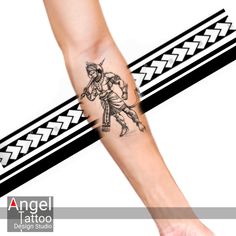 a person with a tattoo on their arm is holding onto a black and white ribbon