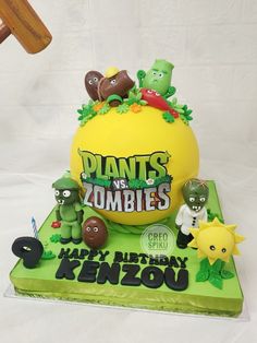 a cake with plants and zombies on it