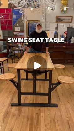 a man standing in front of a wooden table with benches on it and text saying swingseat table