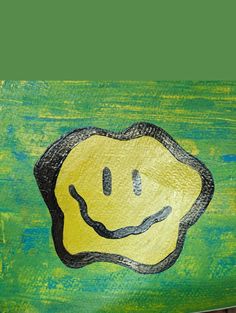 a green and yellow painting with a smiley face