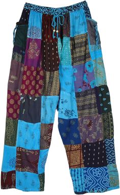 A daywear pair of pants that are as comfy as they look fashionable, these pants are sure to make some heads turn! With an assortment of various Indian print multi-patchwork, the pants look very boho chic.  They have an elastic drawstring waist for ease of comfort and for slight adjustments. #tlb #SplitSkirtsPants #Patchwork #bohemianfashion #Handmade #HippiePantswithPockets #PatchworkCottonPants #GypsyPants Blue Patchwork Trousers, Bohemian Cotton Pants With Floral Patchwork, Bohemian Patchwork Harem Pants, Blue Patchwork Cotton Pants, Blue Patchwork Pants, Hippie Blue Patchwork Bottoms, Bohemian Blue Bottoms With Floral Patchwork, Blue Cotton Patchwork Harem Pants, Blue Patchwork Bottoms For Festival