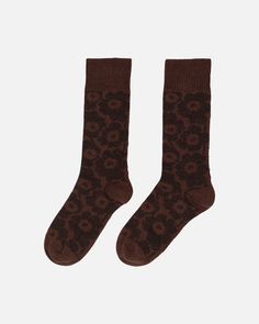 The Oras knitted wool socks feature the Unikko pattern.  This product includes 35% recycled wool and 24% recycled polyamide.  Unikko was created by Maija Isola in 1964 and has since become an international icon of print design. The founder of Marimekko, Armi Ratia, believed that it was not possible to faithfully capture the true essence of real flowers in print, which is why floral prints were earlier excluded from Marimekko collections. So, Maija Isola designed Unikko to be an abstraction of a flower rather than a photorealistic rendition. Today, Unikko is a powerful emblem of joy and creativity, seamlessly integrated into Marimekko´s design identity. Knit Wool Socks, Maija Isola, Design Identity, Wool Socks, Socks And Tights, Real Flowers, A Flower, Cloth Bags, Sale House