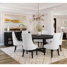 a black and white dining room table surrounded by white chairs with an area rug on the floor