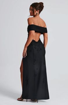 Milani is one of our dreamiest designs of the season, perfect for chasing sunsets and beyond. This maxi dress is soft girl perfection, made in a delicate mesh with playful 3D flower appliques and bardot neckline to show off your shoulders. The dress is complete with a thigh high split and open low back. 



Colour: Black.

Premium stretch mesh.

Fully lined.

3D floral appliques.

Bardot neckline.

Strap detail at back.

Cut out low back.

Thigh high split.

Invisible zip fastening.

Maxi length Prom Dress 2022, Homecoming Dresses Corset, White Dress Spring, Midi Dress Wedding Guest, Exclusive Gowns, Long Sleeve Bridesmaid Dress, Long Sleeve Homecoming Dresses, Senior Stuff, Chasing Sunsets