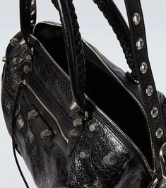 Material: leather.Lining: fabric.Made in Italy.Designer color name: Black.Closure: zipped top.Top handle, Detachable shoulder strap.Zipped front pocket.Internal details: internal zipped pocket.Adjustable length.Height 27cm-10.5'.Width 40cm-15.5'.Max. depth 22cm-8.5'.Length of handles 51cm-20'.Max. length shoulder strap 124cm-49' Designer Bags With Zipper For Daily Use, Designer Shoulder Bag With Zipper For Travel, Designer Travel Shoulder Bag With Zipper, Designer Crossbody Bag With Zipper Closure, Designer Satchel With Zipper Closure, Designer Shoulder Bag With Zipper Closure, Luxury Leather Shoulder Bag With Metal Zipper, Designer Satchel Shoulder Bag With Zipper, Designer Satchel Shoulder Bag With Zipper Closure