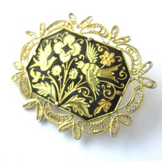 "A pretty gold tone brooch with a black surround and engravings of birds and flowers. A lovely filigree border surrounds the enter carving. Measurements: 2\" wide x 1.5\" tall. It is in lovely condition, just a little finish wear on the outer edges of the filigree. Thanks for looking! vintagedame.etsy.com" Antique Black Brooch For Wedding, Antique Black Wedding Brooch, Antique Black Wedding Brooches, Gold Filigree Brooches As Gifts, Filigree Border, Jewelry Nature, Modernist Ring, Romantic Gifts For Her, Birds And Flowers