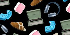 an assortment of electronics and headphones on a black background with pink, blue, and green colors