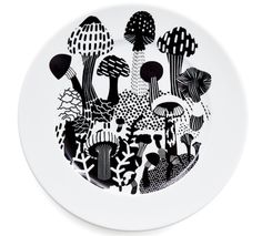 a white plate with black and white designs on the front, featuring different types of mushrooms