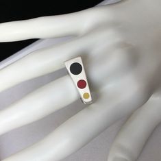 a close up of a ring on a mannequin's hand