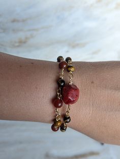 Unleash the power of nature with our stunning red jasper and tiger's eye bracelet, intricately crafted with a handmade chain. Red jasper is known for its grounding properties, promoting stability and endurance, while tiger's eye enhances courage and strength. Each bracelet is a one-of-a-kind creation, brimming with the potent energy of these remarkable stones. Embrace the unique power of this bracelet and embark on your journey with confidence and resilience. https://www.etsy.com/listing/1718274 Adjustable Garnet Gemstone Bracelets, Adjustable Garnet Gemstone Bracelet, Handmade Jasper Bracelets For Healing, Red Agate Bracelets With Gemstone Beads, Red Natural Stones Bracelets For Gift, Adjustable Spiritual Garnet Jewelry, Spiritual Red Agate Bracelets, Red Carnelian Bohemian Bracelets, Adjustable Brown Carnelian Bracelets