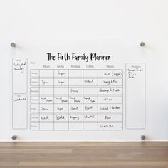 the first family planner wall decal is shown on a white wall with wood flooring