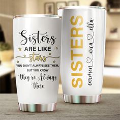 two personalized tumblers sitting on top of a table