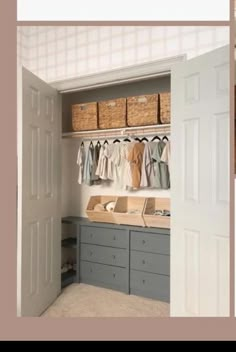 an open closet with clothes and baskets on the shelves