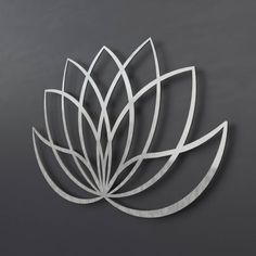 a metal lotus flower on a gray background