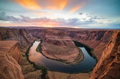 an aerial view of the river and canyons at sunset