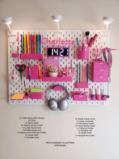 there is a wall mounted shelf with many items on it, including headphones and books