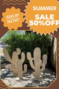 two wooden cactus sculptures sitting next to each other on a sidewalk with the words summer sale 50 % off