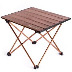 a small wooden table with wheels on the legs and an iron frame around it's edge