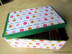 two tins with donuts on them sitting on a table