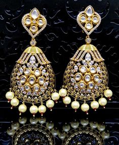 Check out this item in my Etsy shop https://www.etsy.com/listing/696479560/gold-meenakari-kundan-earring-with-cubic Gold Chandelier Earrings With Latkans For Wedding, Gold Temple Jewelry Earrings For Wedding, Gold Round Bridal Earrings For Wedding, Gold Bridal Earrings For Wedding, Gold Plated Chandelier Earrings With Intricate Design For Wedding, Gold Plated Chandelier Earrings For Wedding With Intricate Design, Gold Plated Drop Bridal Earrings In Temple Style, Gold Chandbali Jewelry Sets, Temple Jewelry Style Gold Plated Drop Bridal Earrings