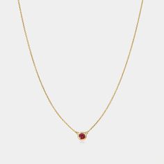 Embrace the passion and love with our Garnet Solitaire Birthstone Necklace. Its deep, rich red hue symbolizes love, friendship, and devotion. Garnet radiates energy, passion, and warmth. The perfect gift for anyone born in January. Gemstone: Natural Garnet Month: January Pendant dimensions: .21" x .21" (5.3mm x 5.3mm) Chain length: 16" (40.5cm), extends to 18" (45.5 cm) Please note, natural gemstones may vary in color. Classic Red 14k Gold Necklace, Ruby Birthstone Necklaces, Red Ruby Gemstone Necklaces, Red Ruby Gemstone Necklace, Red Gemstone Birthstone Necklace Fine Jewelry, Fine Jewelry Red Gemstone Birthstone Necklace, Luxury Gemstone Necklaces As A Gift For Her, Elegant Ruby Birthstone Necklace, Red Round Pendant Necklace Fine Jewelry