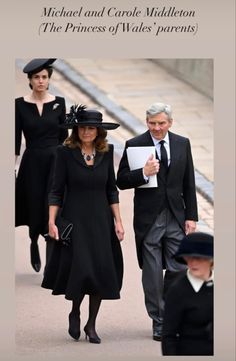 the prince and princess of wales are walking down the street with other people behind them