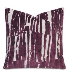 a purple and white pillow on a white background