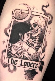 a tattoo with a skeleton holding a woman's head and the words, the lovers