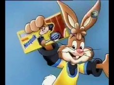 a cartoon rabbit holding a box of cereal