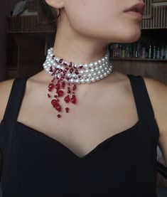 our victorian vampire necklace consists of 4 rows of pearls. there are 26 pearls in each row. 15. from the pearl onwards, blood places are painted with nail polish.(depending on the request, the area covered by the blood part can be increased). the red bead lengths are extended in the shape of the letter V. the longest red array at normal lengths is 7 cm (the length of the red array can be increased at will.) you can send me a message for specific requests. the design is made specially for the p Vampire Choker, Necklace Vampire, Vampire Bite, Vampire Earrings, Vampire Necklace, Vampire Bites, Victorian Vampire, Dark Jewelry, Pearl Jewelry Design